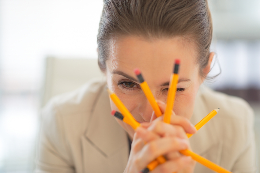 Business Woman holding pencils